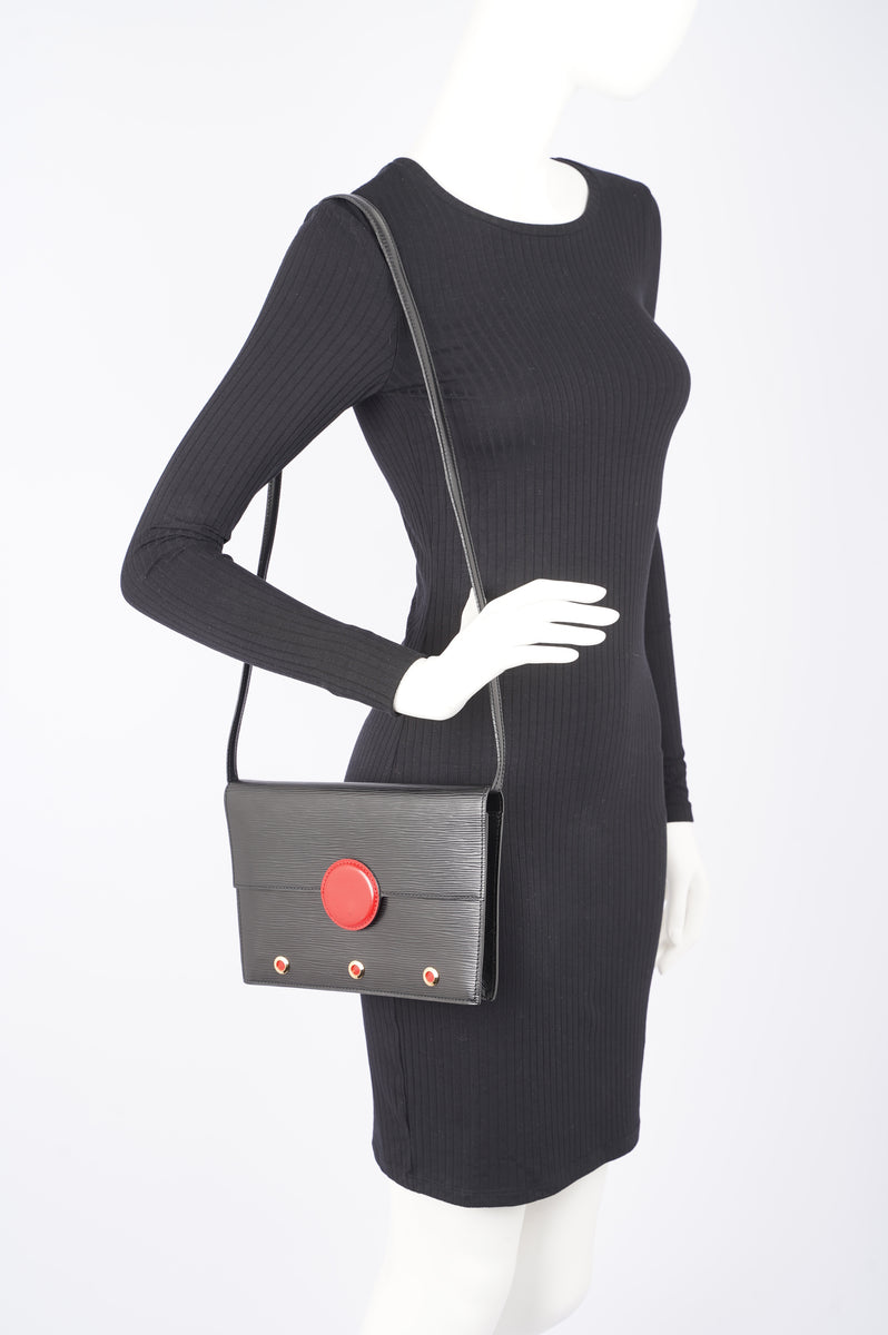 Vintage Louis Vuitton black epi mod clutch, shoulder bag with a red eye  hublot.