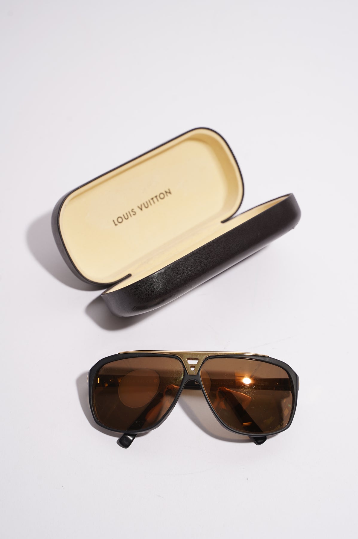 Louis Vuitton Monogram Engraved Evidence Sunglasses black gold Unisex 2d  drop